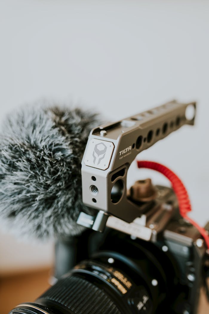 services-02 Professional camera with a microphone and handle bar setup for video recording.